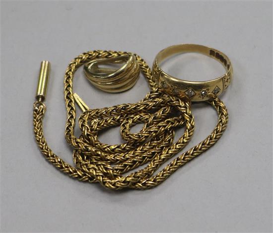 An Edwardian 18ct gold and gypsy set diamond ring, a 14ct gold pendant and a yellow metal chain.